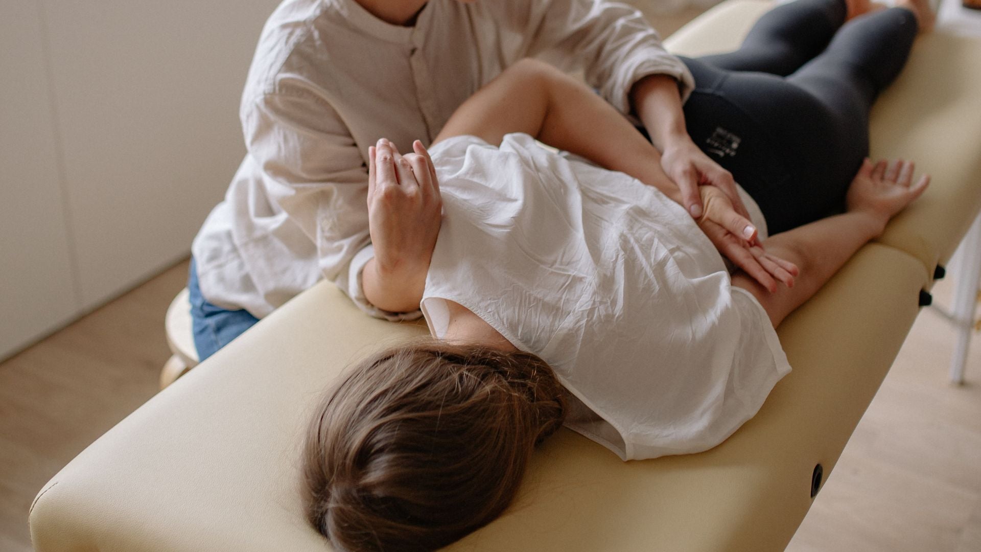 woman laying on chiropractic table